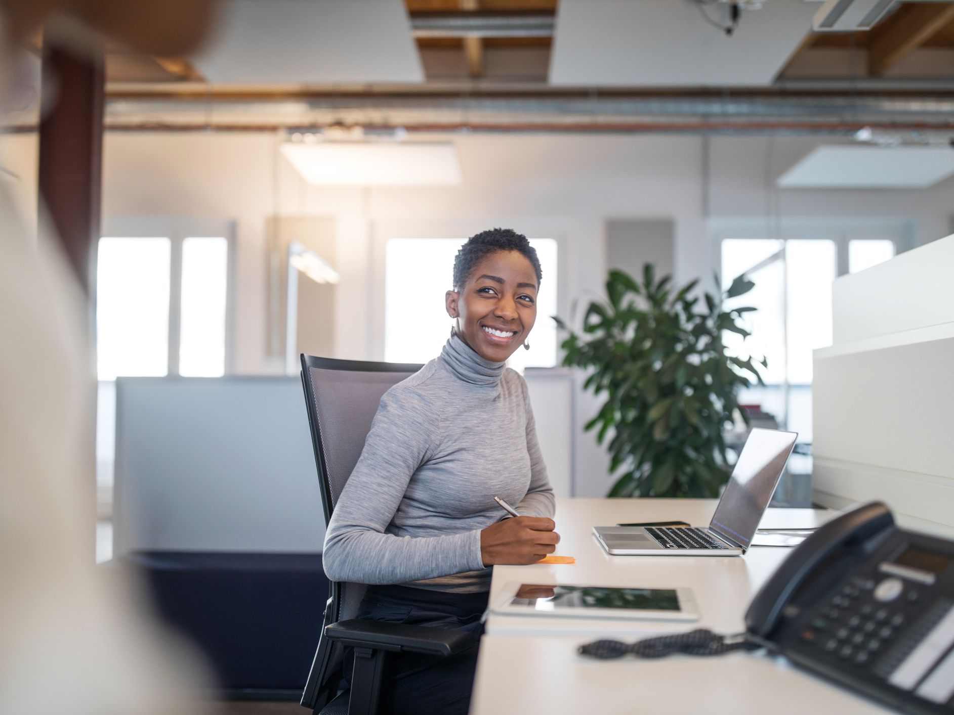 A female professional working at her desk